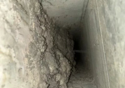 air duct filled with dust and debris